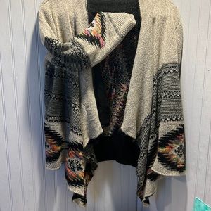Cardigan. Tan w black, draping front, accented with multi-color Aztec design.